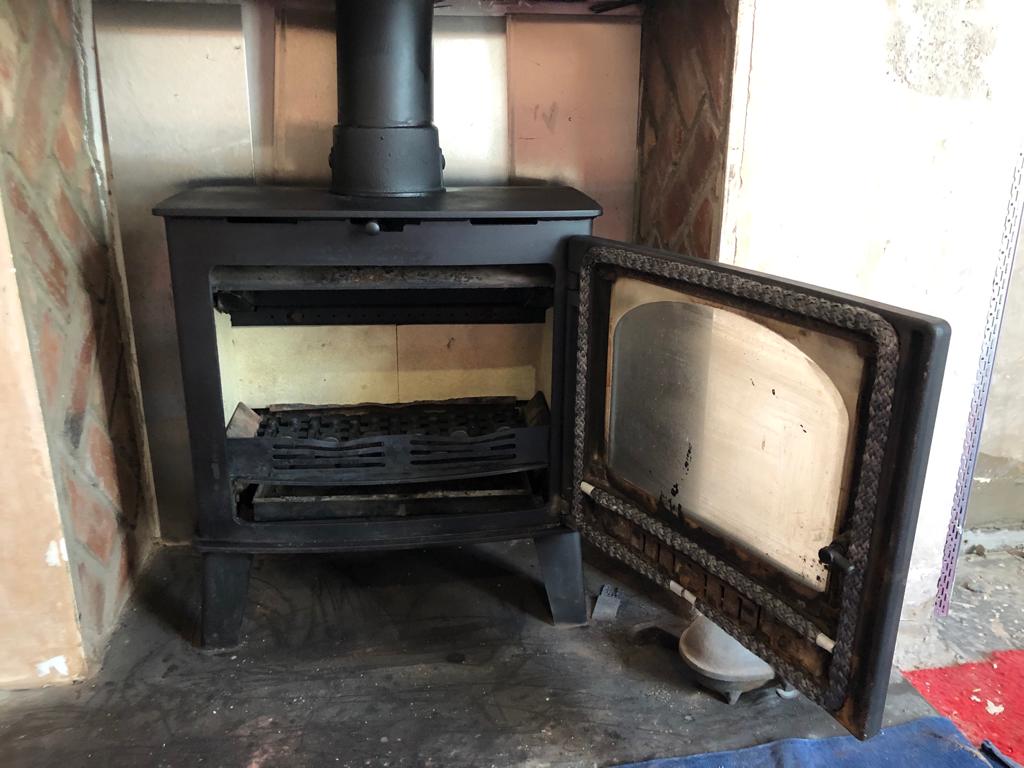 Stove with new firebricks, grate etc by Chimney Sweeps North East